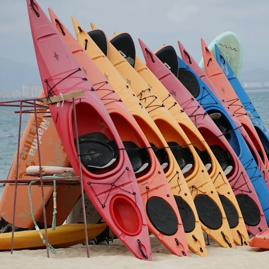 Colorful kayaks racked on the beach
